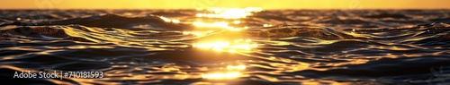 The sun shines out into the water at sunset © BrandwayArt