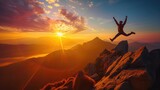 Victory jump of a young guy on a mountaintop at sunrise. He is celebrating as he reaches the top when first rays of autumn morning sun start spilling over the alpine hilltop.