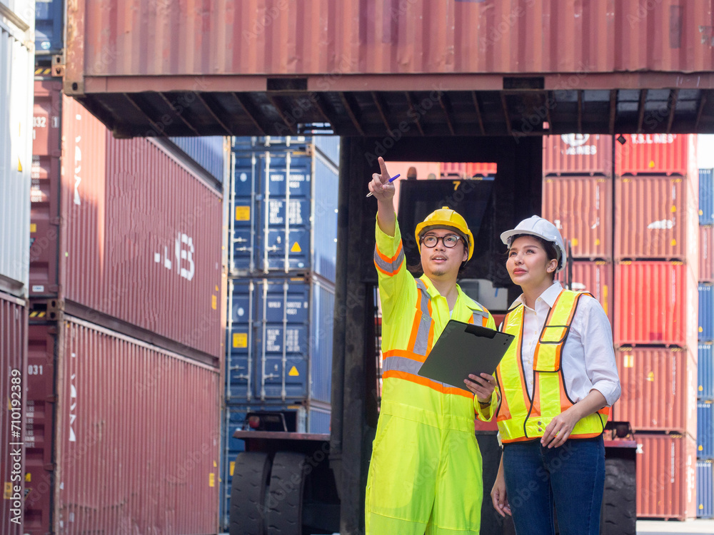 Crane forklift cargo container box good import export manager supervisor director pointing finger cheerful yellow white hardhat helmet safety engineer import export warehouse business logistic report Crane forklift cargo container box good import export manager supervisor director pointing finger cheerful yellow white hardhat helmet safety engineer import export warehouse business logistic report