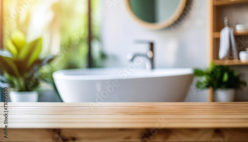 Serene white bathroom interior with minimalist design, showcasing an empty wooden tabletop for product display, featuring blurred bathroom elements. Clean, modern, and inviting
