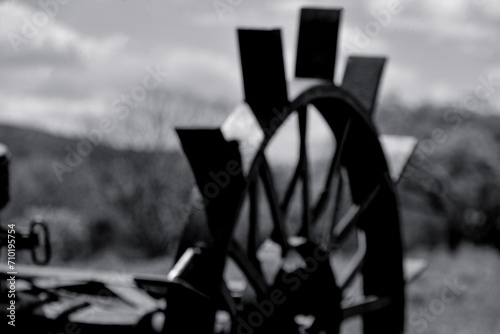 old machinery, drag mower, tractor part, farmer's day, agriculture, field, farm, plantation, rural activity, blurred background, black and white image, photo panel photo