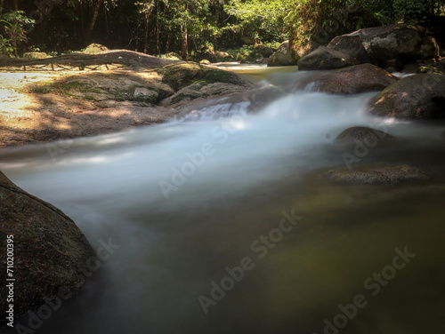 Fototapeta Naklejka Na Ścianę i Meble -  natural beauty of a rain forest waterfall in long exposure