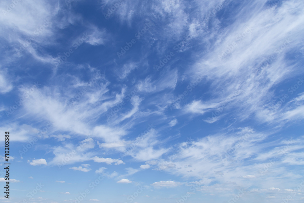 Beautiful soft gentle cloudy blue sky with white cirrus clouds, abstract background texture