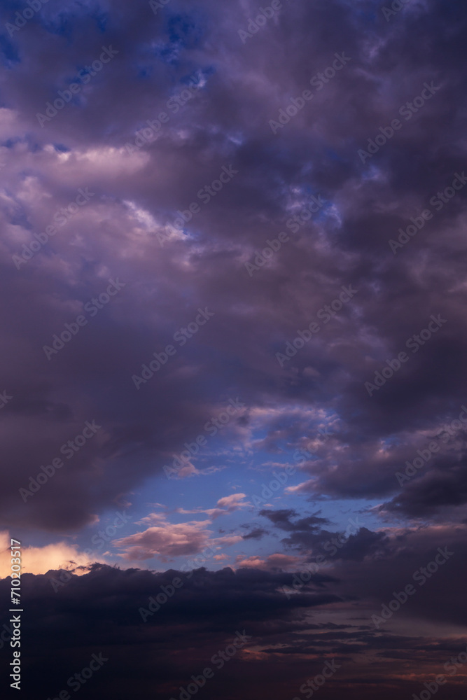 Epic dramatic sunrise, sunset pink violet blue sky with dark storm clouds background texture Epic dramatic sunrise, sunset pink violet blue sky with dark storm clouds background texture