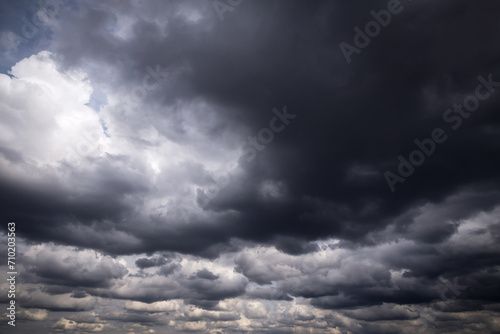 Epic Dramatic Storm sky with dark grey and black cumulus rainy clouds background texture, thunderstorm 