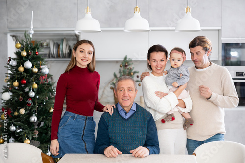 Family members posing for photos on Christmas holidays photo