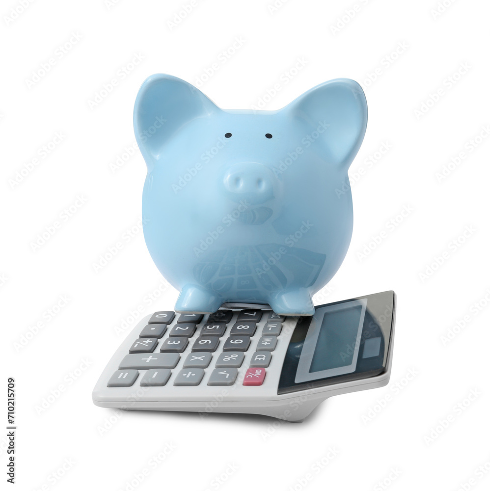 Calculator and piggy bank isolated on white Calculator and piggy bank isolated on white