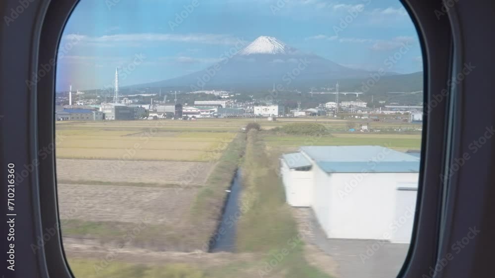 View of Mount Fuji through the window onboard a high speed train in Japan