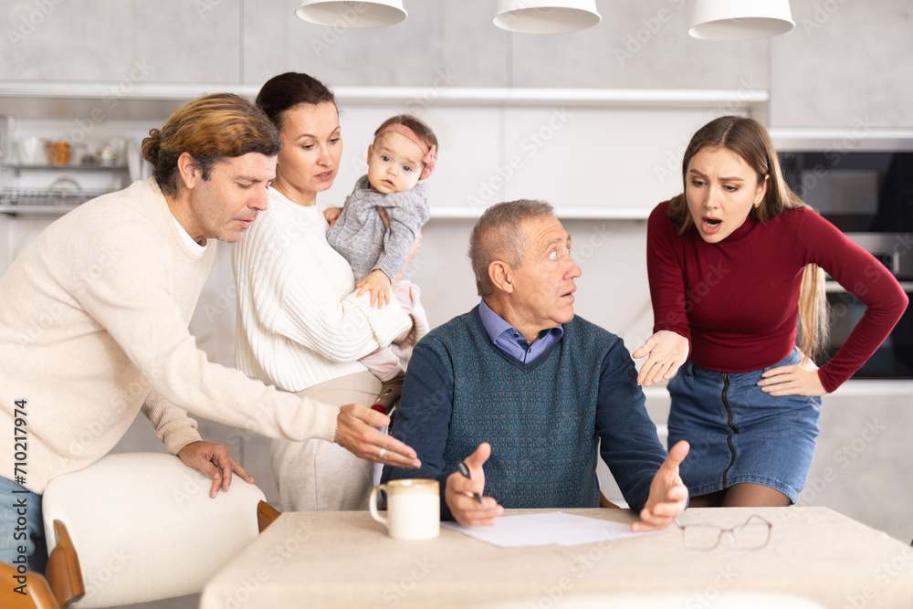 Family members giving advice to old man and discussing inheritance
