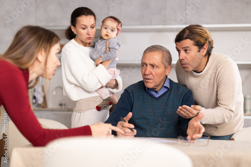 Family members giving advice to old man and discussing inheritance