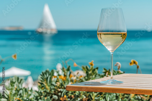 Serene Ocean View with Wine Glass and Sailboat