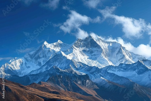 A majestic mountain range with snow-capped peaks and a clear blue sky Capturing the awe-inspiring beauty of nature