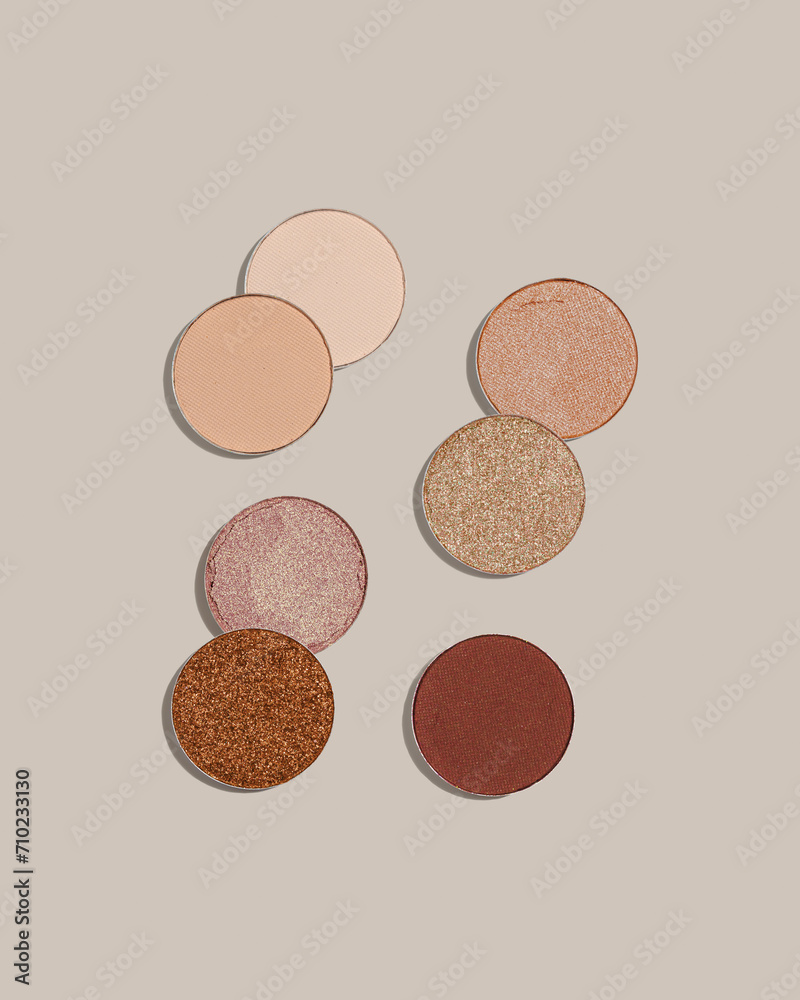 Pattern with eye shadow beige brown natural color on neutral colored background. Makeup palette, set of swatches eyeshadows powder, shine and matte, minimal style, pastel colored, flat lay Pattern with eye shadow beige brown natural color on neutral colored background. Makeup palette, set of swatches eyeshadows powder, shine and matte, minimal style, pastel colored, flat lay