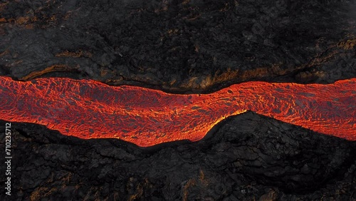 Lava river from active volcano. Red hot burning lava erupts from ground in Iceland. Incredible aerial of the dramatic volcanic eruption of the Litli Hrutur. Shot in 5k resolution. photo