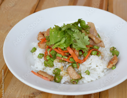 rice fried with chicken and vegetables