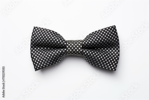 Black bow tie against a white backdrop