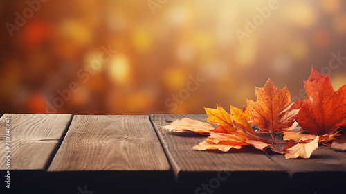 simple design wooden table with orange autumn leaves background