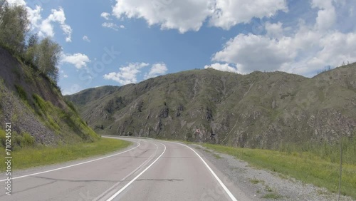 Video of driving in a car In summer season along the mountain road in Altai. photo