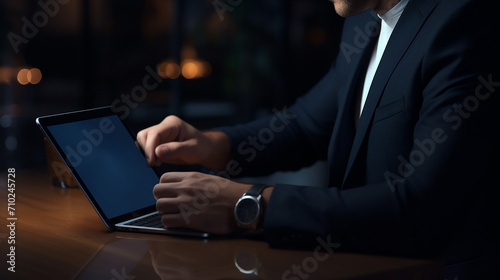 close up view of man using blank screen tablet while working in dark modern workspace