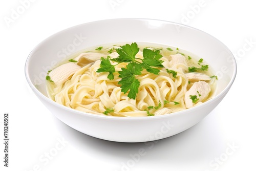 White ceramic bowl with instant chicken noodle soup isolated on white topped with parsley