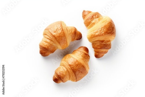 French breakfast with fresh croissants presented creatively on a white background representing healthy and delicious food From a top view perspective it serves photo