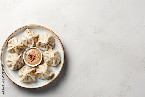 Georgian cuisine s traditional set of Khinkali dumplings on white stone viewed from the top with space for text photo