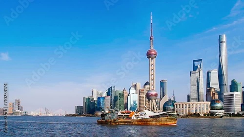 Shanghai bund skyline lujiazui timelapse in a clear day with blue sky.