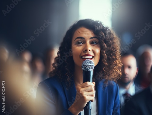 Confident Question: Seminar Attendee with Microphone,Engaged Seminar Participant © AKKA