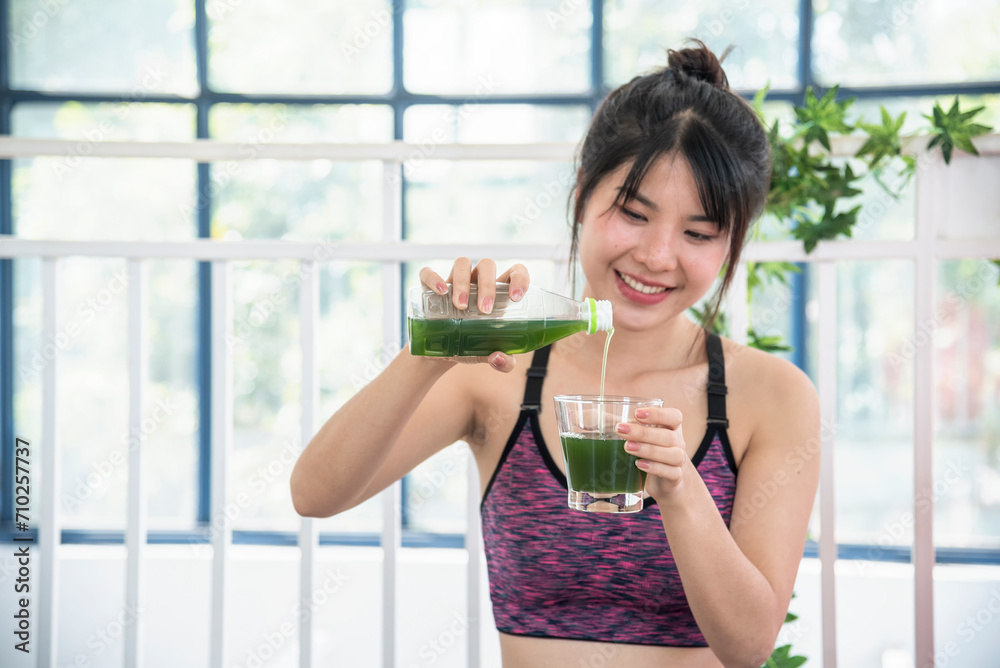 Women hands holding smoothie detox green juice fresh fruit cool drinking. Asian women smile laugh drinking vegan vegetable cool wellness beverage. Female pouring celery juice drink cocktail glass Women hands holding smoothie detox green juice fresh fruit cool drinking. Asian women smile laugh drinking vegan vegetable cool wellness beverage. Female pouring celery juice drink cocktail glass