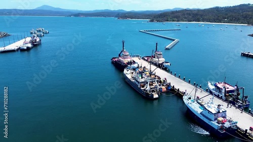 Drone aerial Twofold Bay waterfront dock pier fishing trawlers industry recreation tourism coastline Eden Sapphire Coast Australia photo