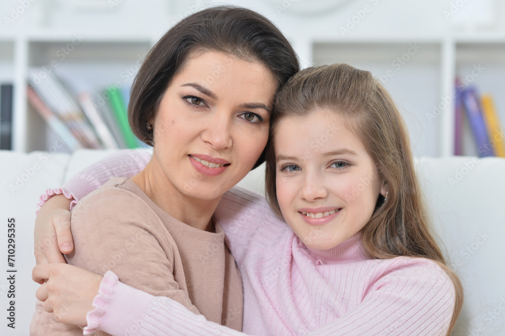 Close-up portrait of a charming girl with mom Close-up portrait of a charming girl with mom