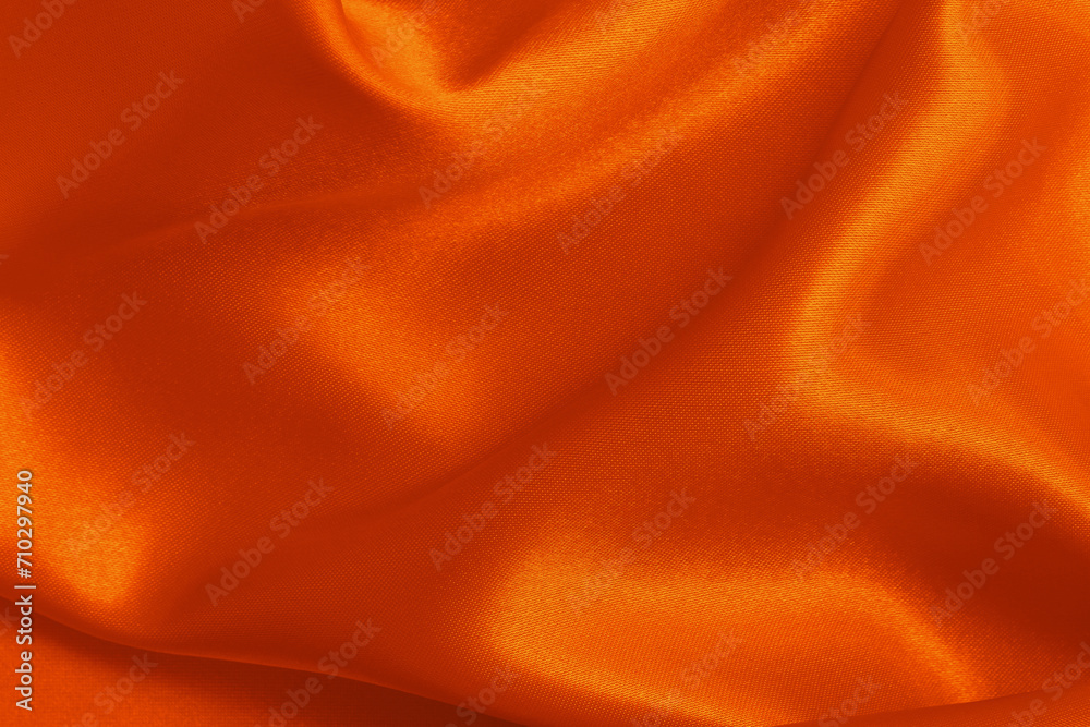 Fototapeta premium Orange fabric cloth texture for background and design art work, beautiful crumpled pattern of silk or linen.