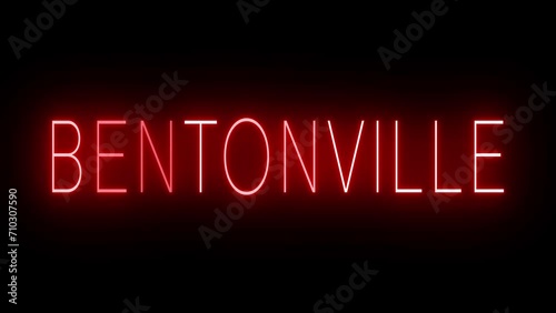 Flickering red retro style neon sign glowing against a black background for BENTONVILLE photo