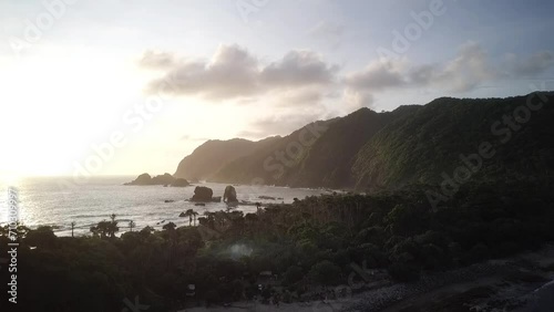 natural scenery accompanied by clear skies, beautiful trees and green mountains. A very beautiful aerial drone for the concept of natural scenery. Flight over woods, natural background in motion