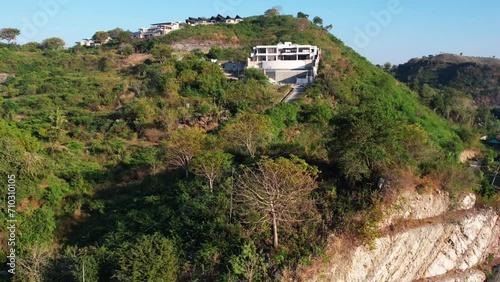 natural scenery accompanied by clear skies, beautiful trees and green mountains. A very beautiful aerial drone for the concept of natural scenery. Flight over woods, natural background in motion