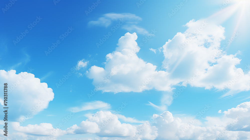 clear blue sky background with clouds and sun bright