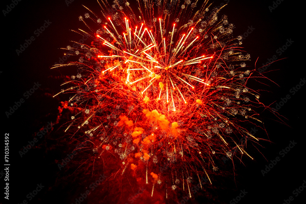 Beautiful red firework at night. Selective focus. Beautiful red firework at night. Selective focus.