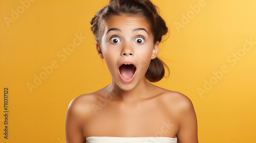 Young surprised shocked amazed excited woman, girl with expression,  copy space for advertisement of shocked afraid woman looking with eyes at empty place having wide open, Valentine day, sale, women  photo