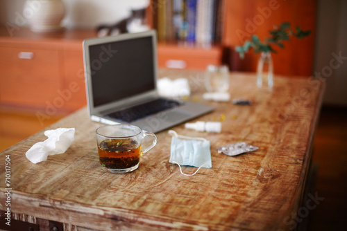 Medications on table near laptop