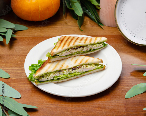 Sandwich with chicken and pesto sauce.