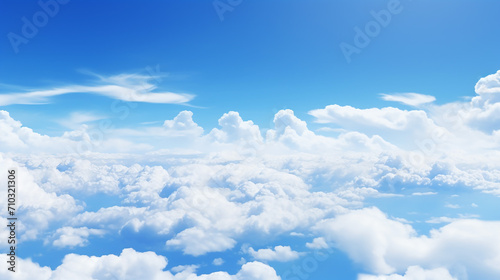 an aerial background view from of clear blue skies with clouds © Aura