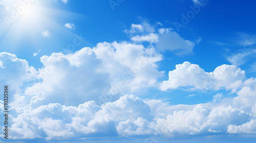 blue sky with bright sunlight and white clouds background
