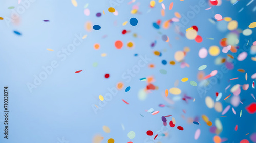 Colorful confetti flying in the air against a blue background, Generative AI
