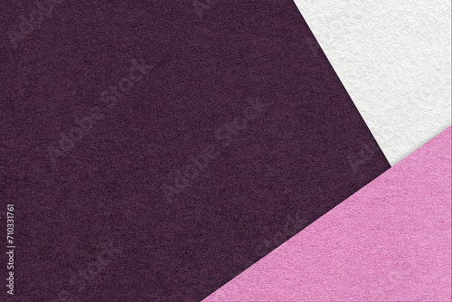 Texture of craft dark purple color paper background with white and lilac border. Vintage abstract wine cardboard.