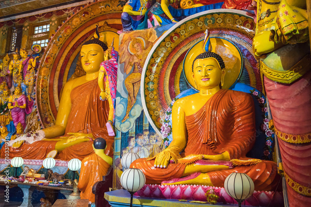 Buddha statues and colorful decoration of the Gangaramaya temple, Colombo, Sri Lanka