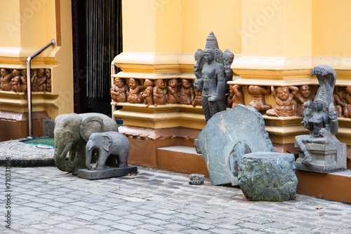 Ancient statues at the entrance of Gangaramaya Temple, Colombo