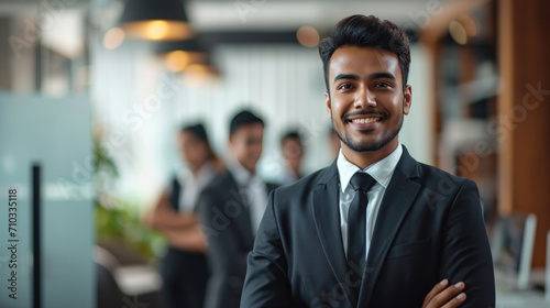 Wallpaper Mural Portrait of a handsome smiling asian indian businessman boss standing in his modern business company office. Torontodigital.ca