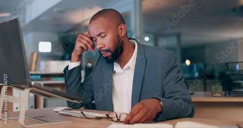 Business man, tired and stress on laptop for office fail, stock market mistake or bankruptcy at night. African trader or corporate worker with headache, breathing and angry or frustrated on computer photo
