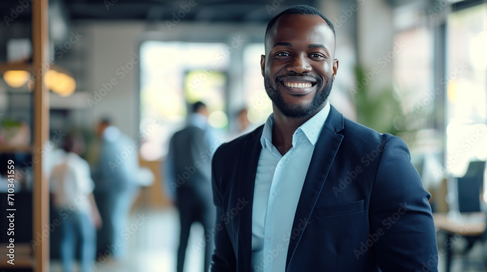 Portrait of a handsome smiling black businessman boss standing in his modern business company office. - obrazy, fototapety, plakaty 