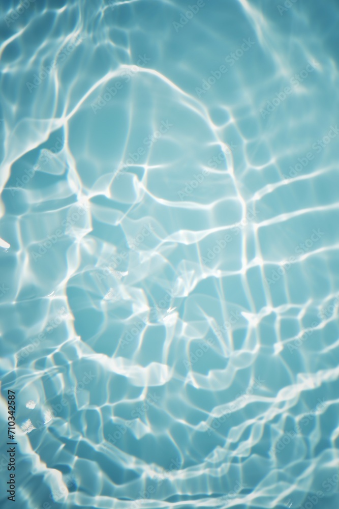 Obraz premium Bluewater waves on the surface ripples blurred. Defocus blurred transparent blue colored clear calm water surface texture with splash and bubbles. Water waves with shining pattern texture background.